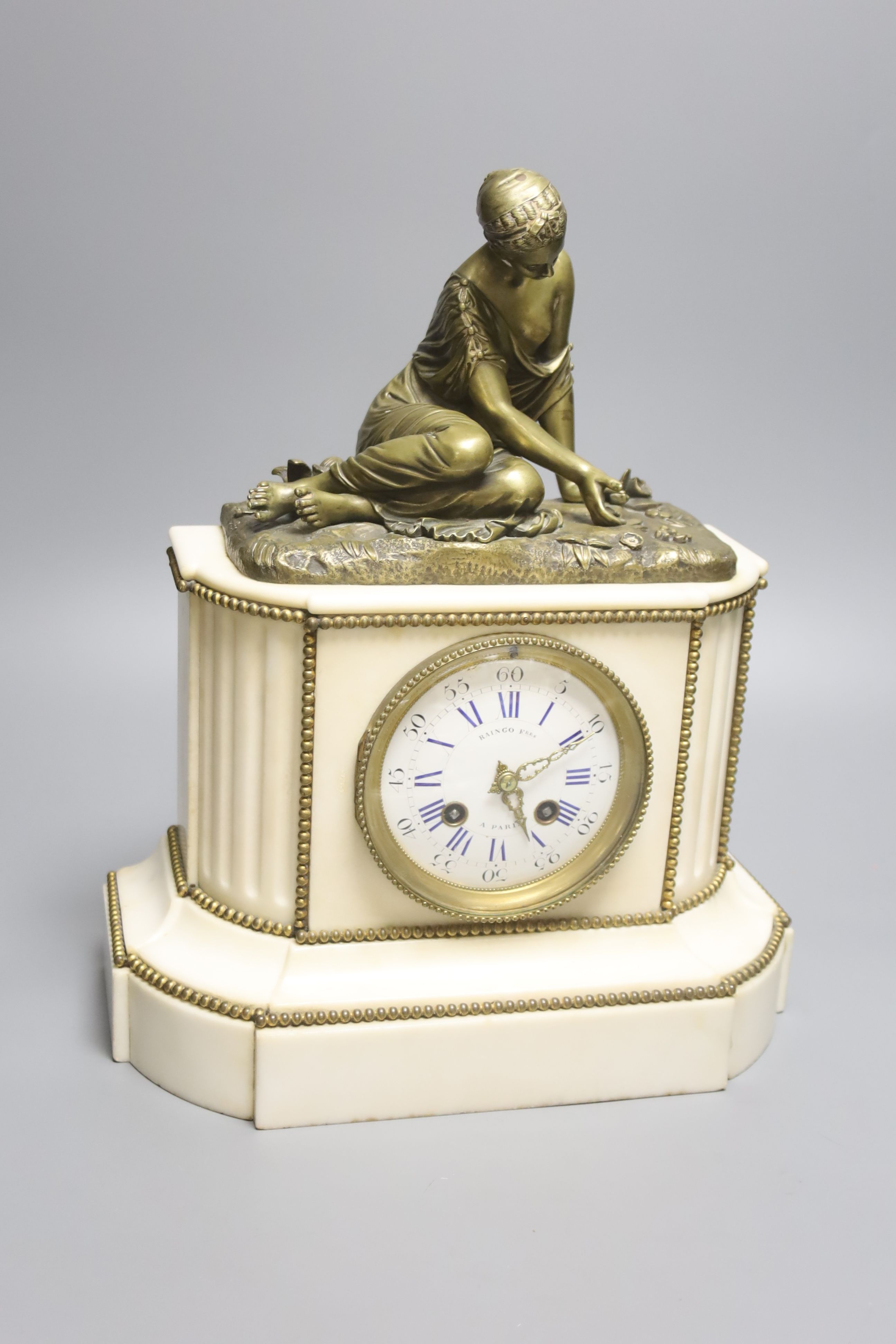 A 19th century French bronze and marble figural mantel clock, height 35cm